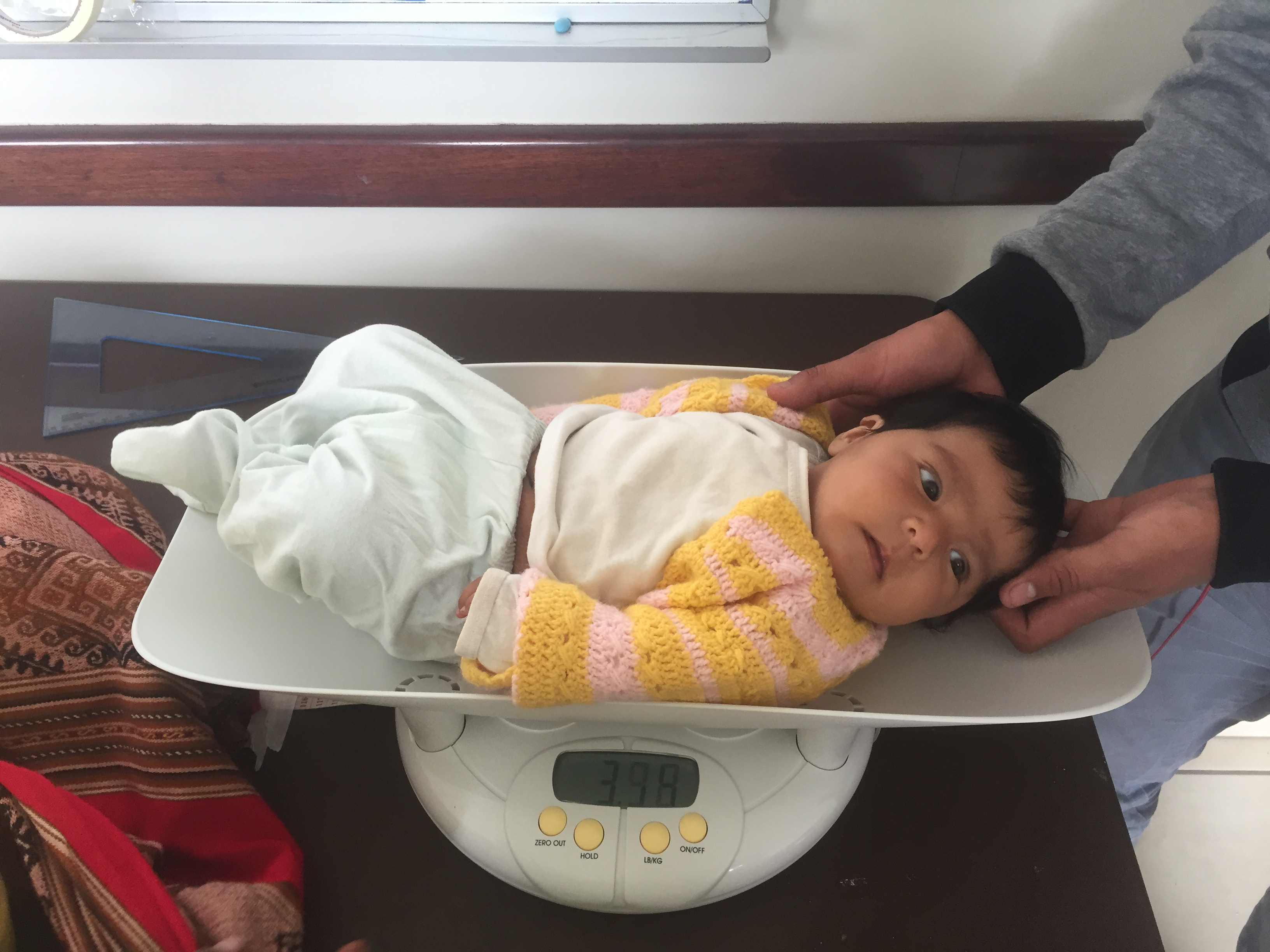 Urubamba-screening-baby-being-weighed-1