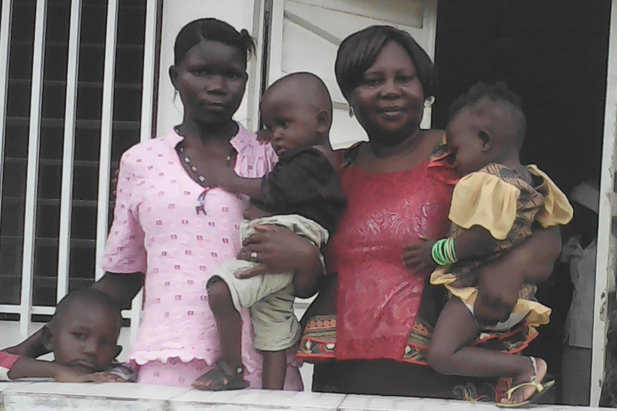 Sierra-Leone-9-25-2016-Agnes-with-twins-and-mother-at-church-investigating-and-soon-to-be-baptized-parents-Cropped